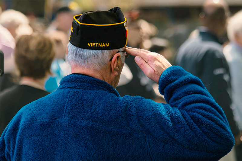 A Vietnam Veteran saluting